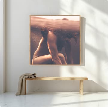 Framed picture sitting on a wooden bench